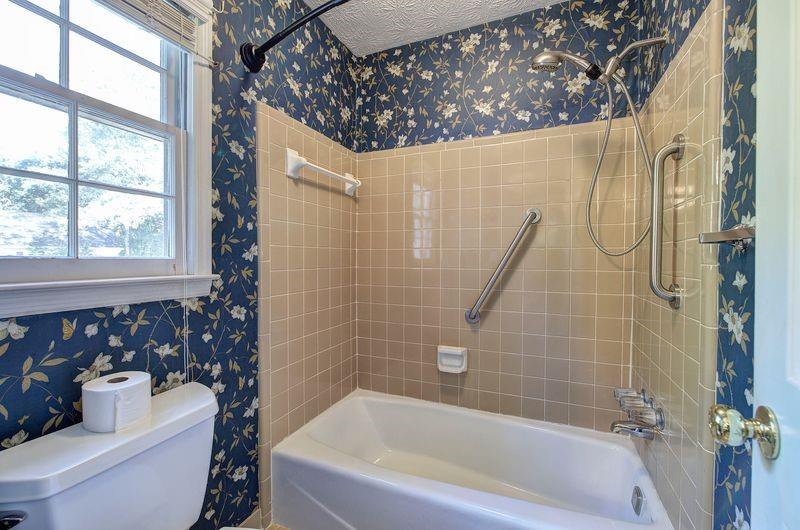260 Spring Ridge Drive Roswell, GA 30076 - Photo 26 of 52 a bathroom with a toilet and a bathtub