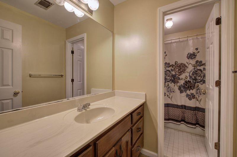 260 Spring Ridge Drive Roswell, GA 30076 - Photo 33 of 52 a bathroom with a sink and a mirror