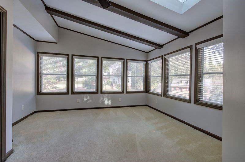 260 Spring Ridge Drive Roswell, GA 30076 - Photo 8 of 52 a view of an empty room with a window