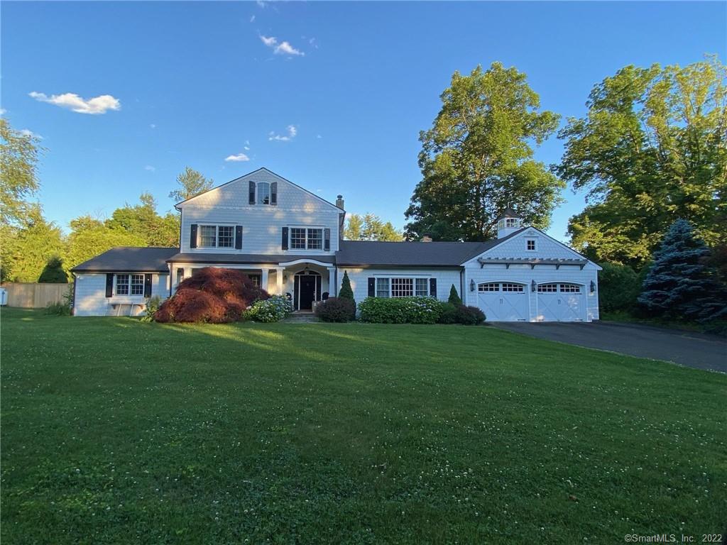 74 Pheasant Ridge Road Redding, CT 06896 - Photo 1 of 1 a front view of a house with garden