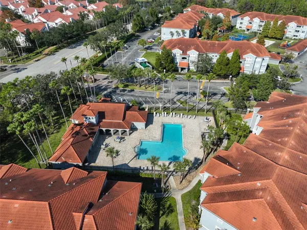 an aerial view of a house with yard swimming pool and outdoor seating