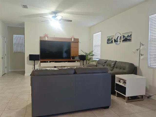 a kitchen with stainless steel appliances kitchen island granite countertop a stove top oven and sink