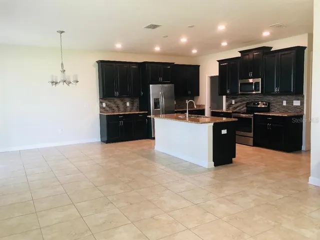 a living room with a couch and a window
