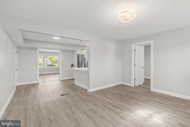 a view of an empty room and window