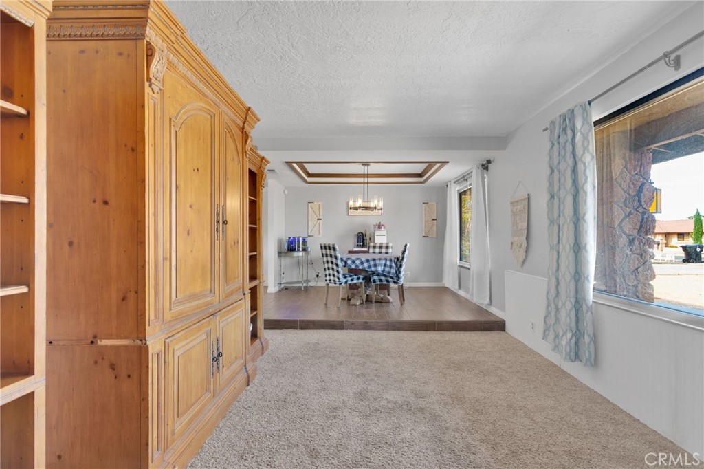 20357 Ituma Road Apple Valley, CA 92308 - Photo 11 of 38 a view of a livingroom with dining room and hardwood floor