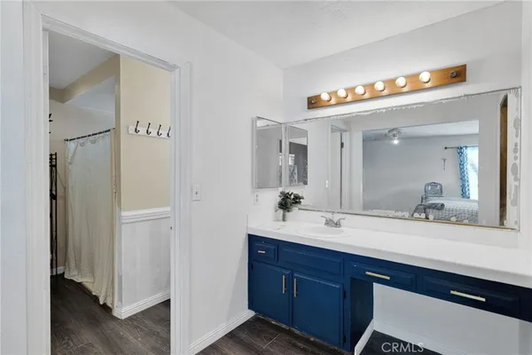 a bathroom with a sink double vanity and a mirror
