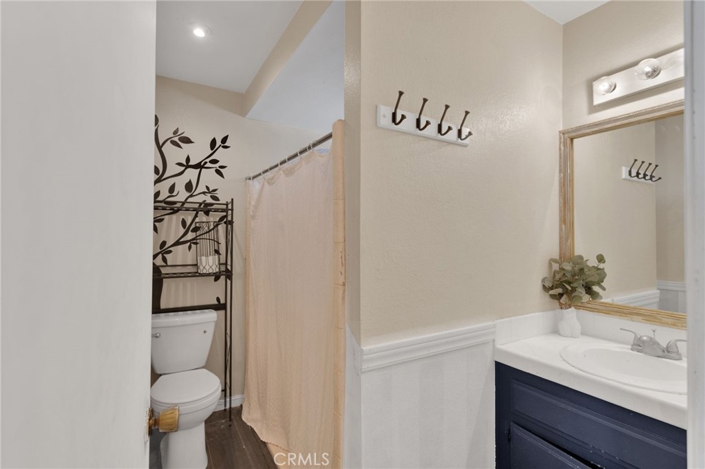 20357 Ituma Road Apple Valley, CA 92308 - Photo 16 of 38 a bathroom with a sink and a mirror