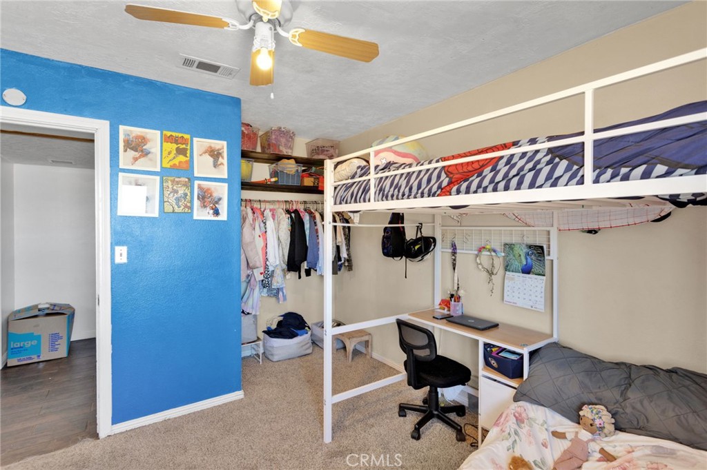 20357 Ituma Road Apple Valley, CA 92308 - Photo 21 of 38 a work room with furniture and a chandelier