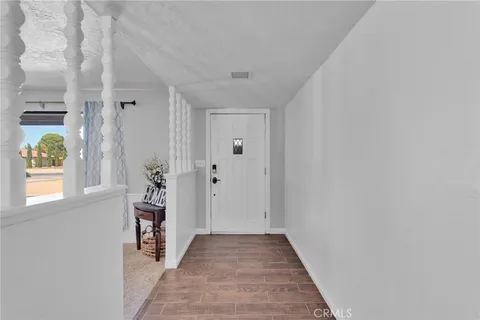 a view of a patio with a table and chairs