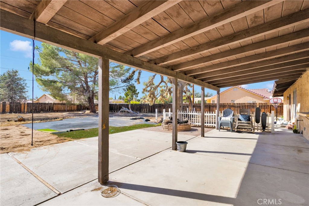 20357 Ituma Road Apple Valley, CA 92308 - Photo 29 of 38 a view of a patio with a table and chairs