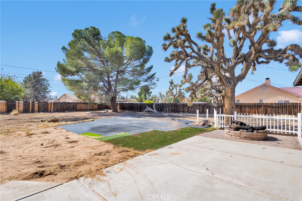 20357 Ituma Road Apple Valley, CA 92308 - Photo 30 of 38 a view of a swimming pool with an outdoor space and seating area