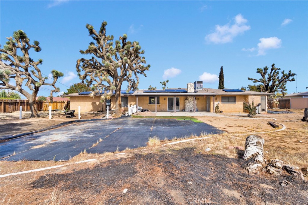 20357 Ituma Road Apple Valley, CA 92308 - Photo 31 of 38 a front view of a house with a yard