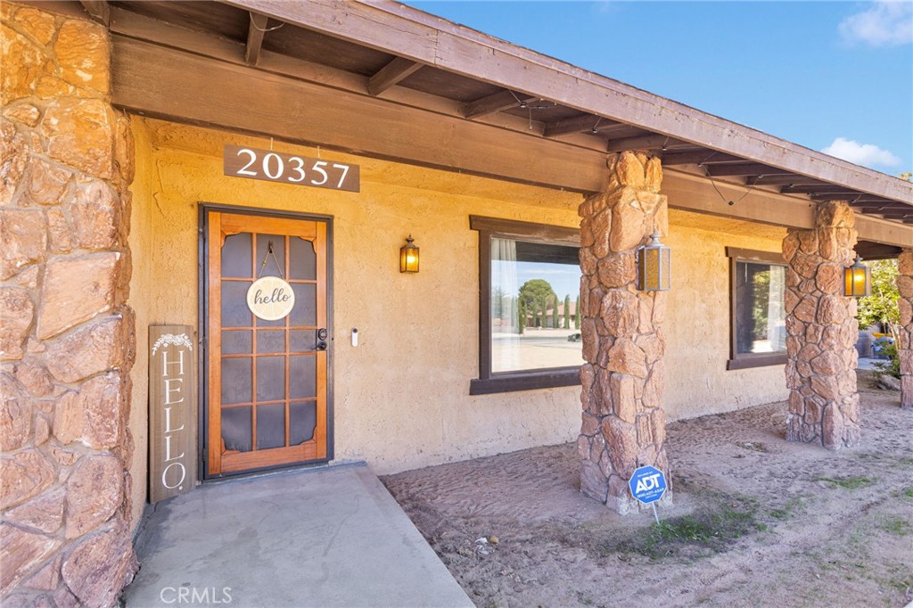 20357 Ituma Road Apple Valley, CA 92308 - Photo 34 of 38 a front view of a house with a porch