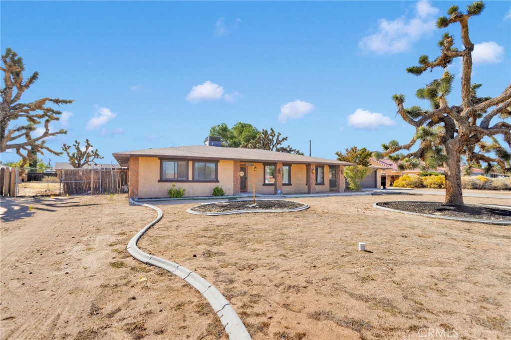 20357 Ituma Road Apple Valley, CA 92308 - Photo 35 of 38 a front view of a house with a yard