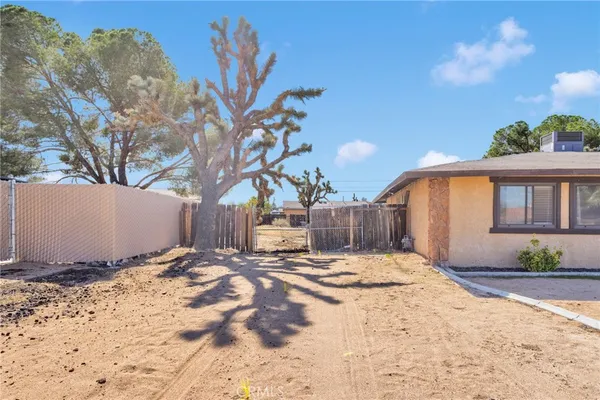 a front view of a house with a yard and a garage