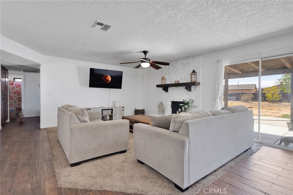 20357 Ituma Road Apple Valley, CA 92308 - Photo 4 of 38 a living room with furniture and a flat screen tv