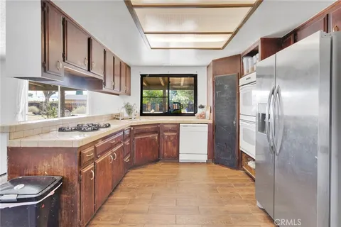 a kitchen with a sink stove and refrigerator