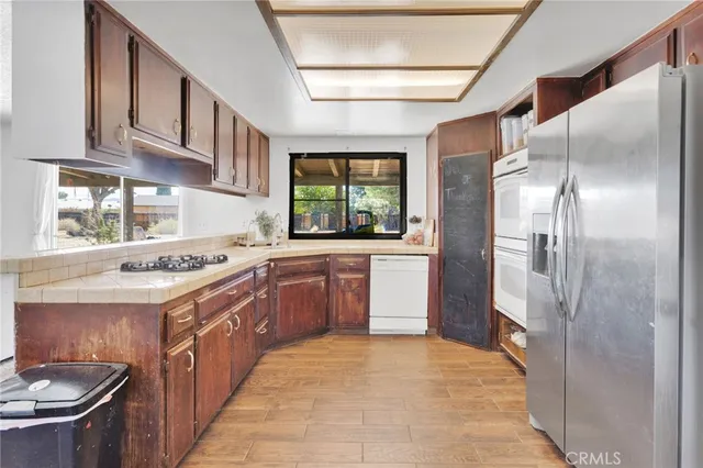 a kitchen with a sink stove and refrigerator