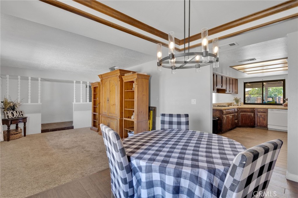 20357 Ituma Road Apple Valley, CA 92308 - Photo 8 of 38 a bedroom with a bed a dresser and flat screen tv