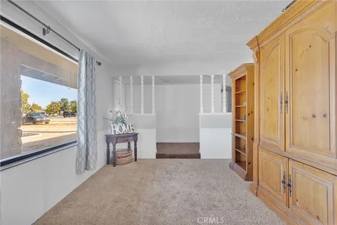 a view of a hallway with windows