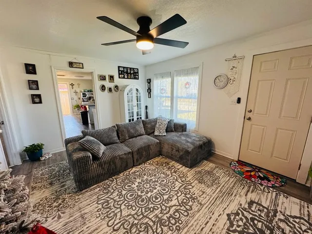 a living room with furniture and a rug