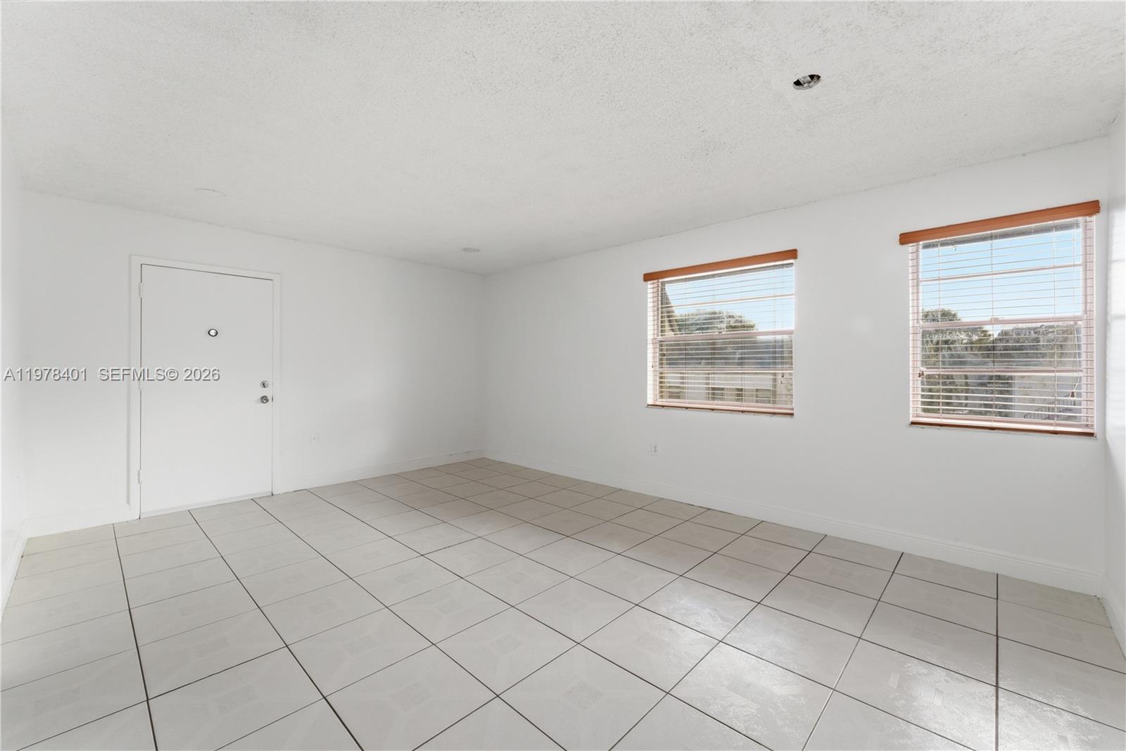6921 Southwest 129th Avenue, Unit 5 Miami, FL 33183 - Photo 15 of 34 a view of an empty room and window