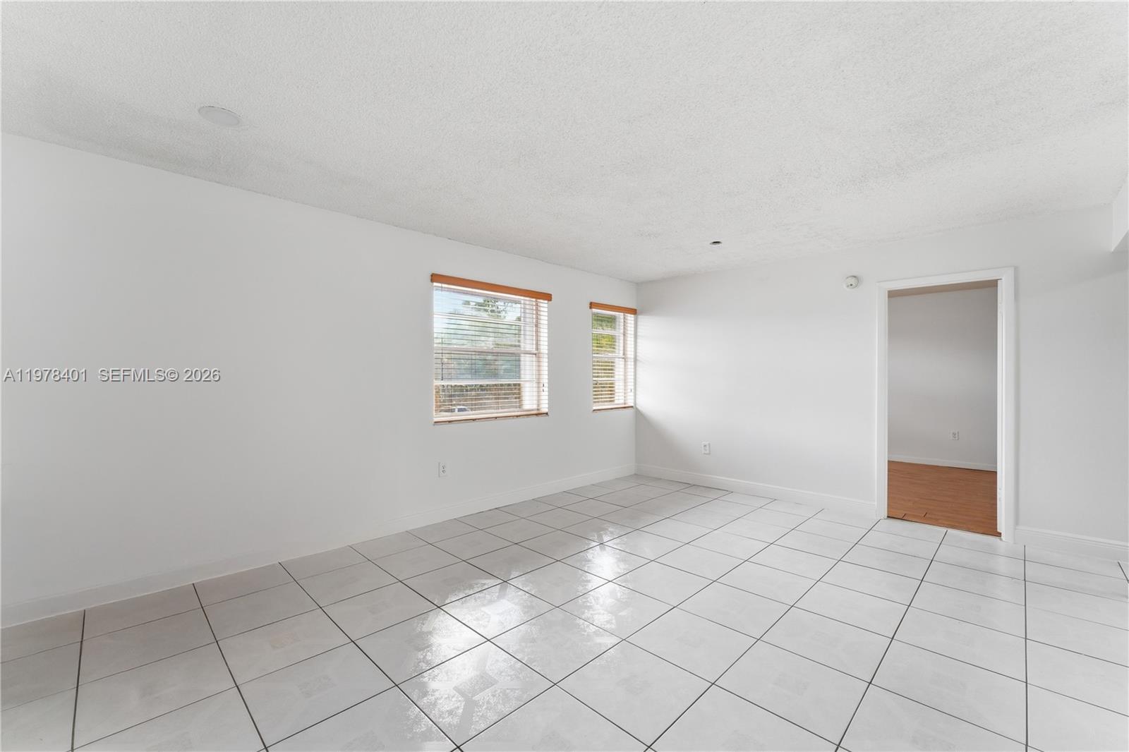 6921 Southwest 129th Avenue, Unit 5 Miami, FL 33183 - Photo 18 of 34 a view of an empty room and window