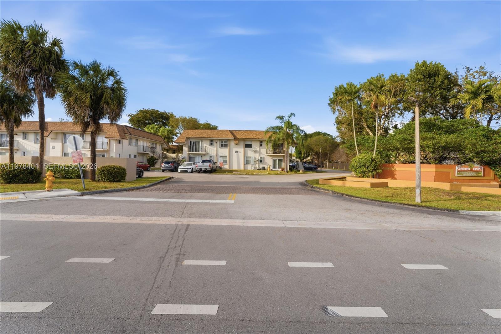 6921 Southwest 129th Avenue, Unit 5 Miami, FL 33183 - Photo 19 of 34 a view of a street with houses