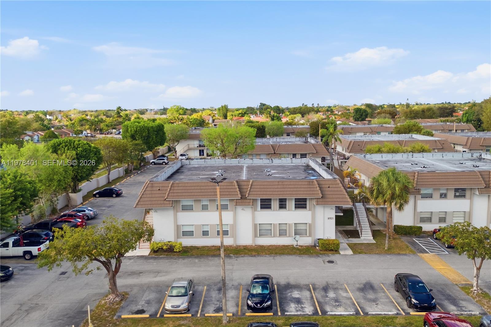 6921 Southwest 129th Avenue, Unit 5 Miami, FL 33183 - Photo 21 of 34 an aerial view of residential houses with outdoor space