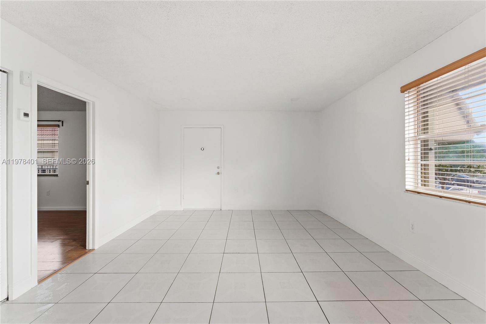 6921 Southwest 129th Avenue, Unit 5 Miami, FL 33183 - Photo 23 of 34 an empty room with windows
