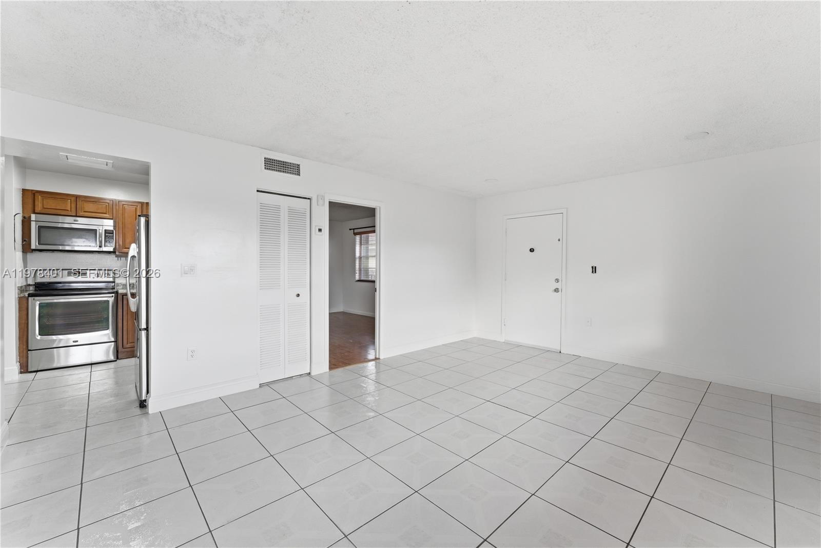 6921 Southwest 129th Avenue, Unit 5 Miami, FL 33183 - Photo 8 of 34 a view of an empty room and window