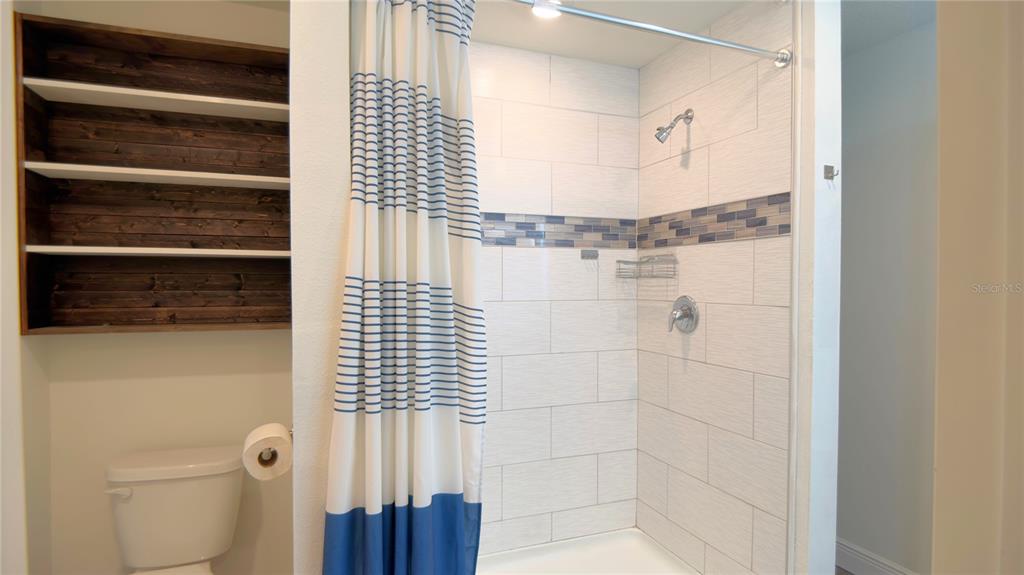 13574 Southwest 47th Circle Ocala, FL 34473 - Photo 11 of 25 a bathroom with a shower