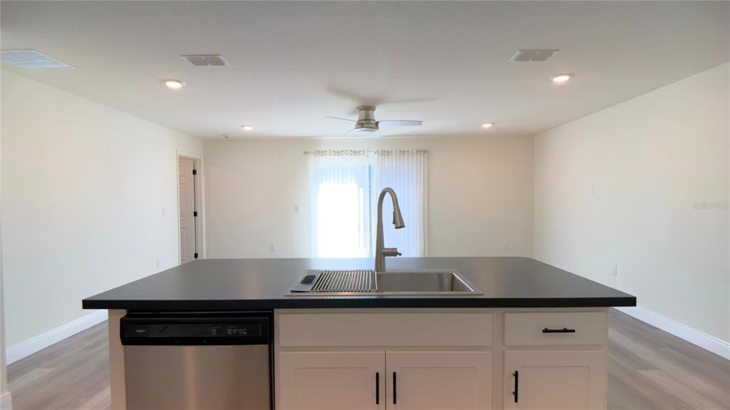 13574 Southwest 47th Circle Ocala, FL 34473 - Photo 14 of 25 a kitchen with a sink and cabinets
