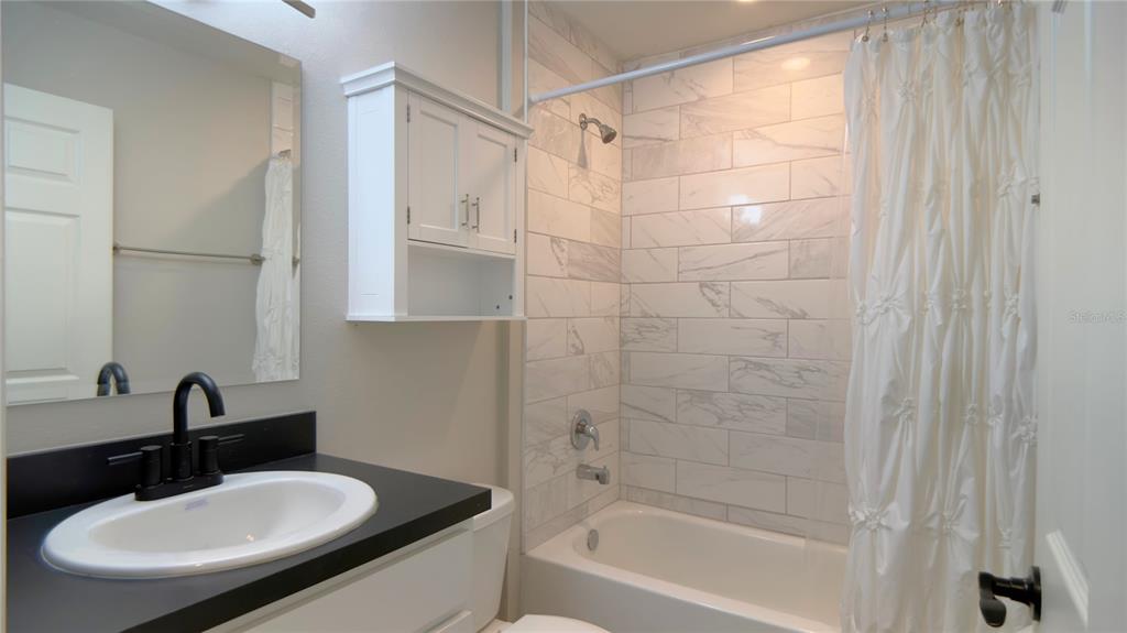 13574 Southwest 47th Circle Ocala, FL 34473 - Photo 18 of 25 a bathroom with a sink and a mirror