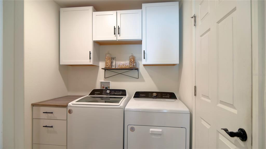 13574 Southwest 47th Circle Ocala, FL 34473 - Photo 22 of 25 a view of storage and utility room with washer and dryer