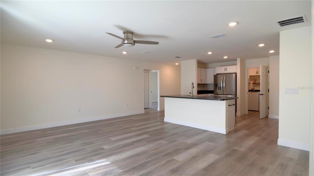 13574 Southwest 47th Circle Ocala, FL 34473 - Photo 10 of 25 a view of kitchen with kitchen island white cabinets and stainless steel appliances