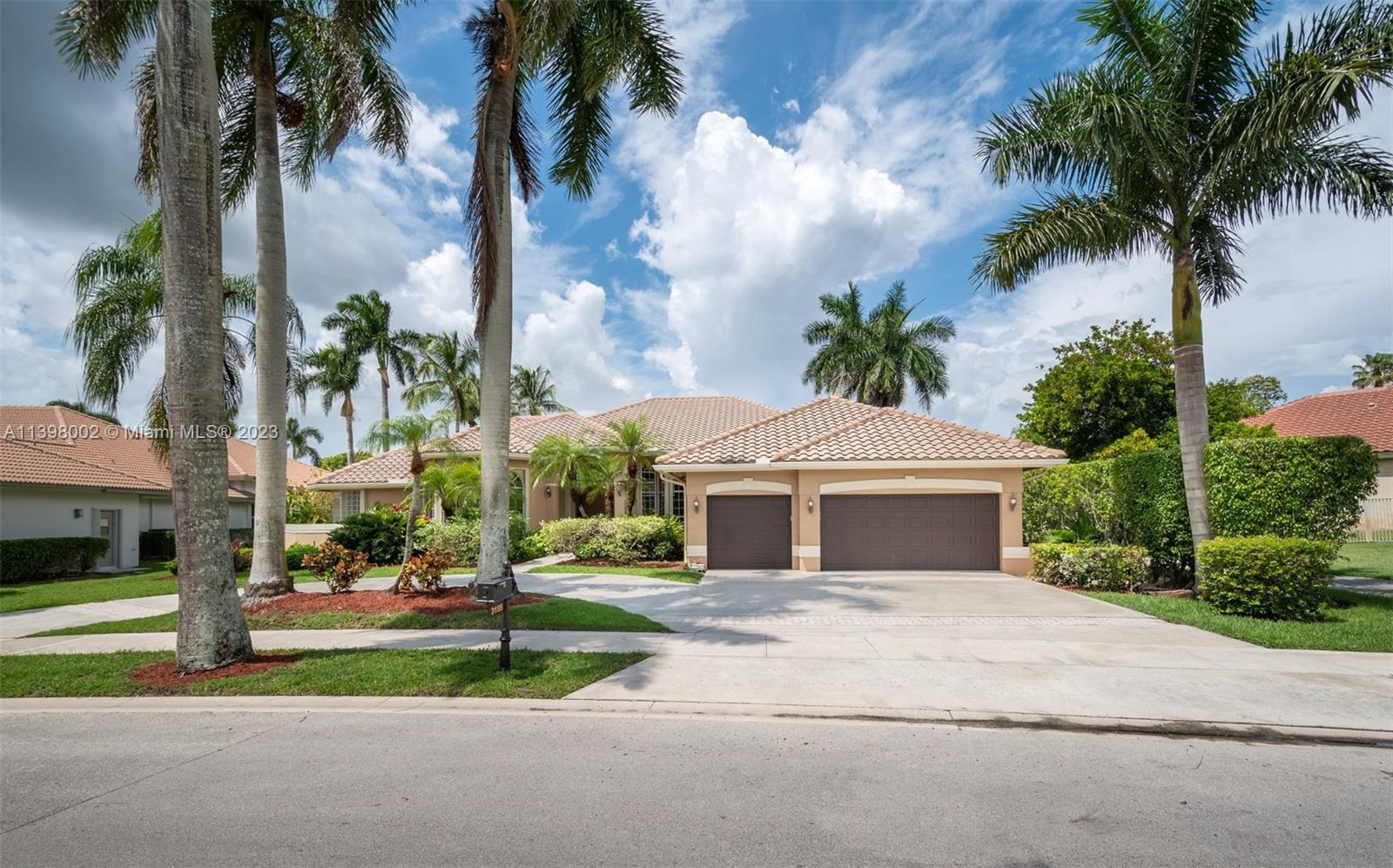 a front view of house with yard and green space