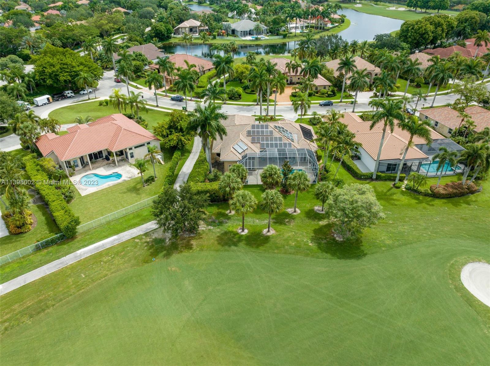 3155 Inverness Weston, FL 33332 - Photo 11 of 58 an aerial view of residential houses with outdoor space and trees