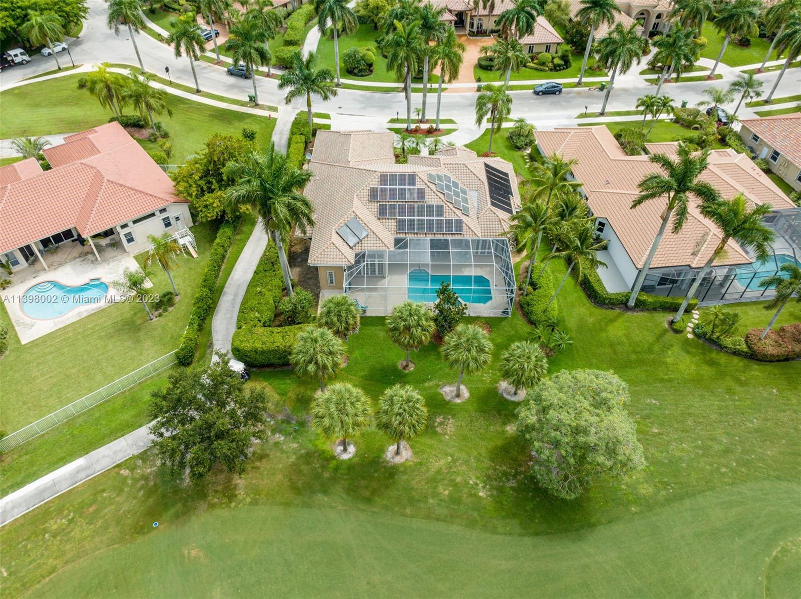 3155 Inverness Weston, FL 33332 - Photo 12 of 58 a view of swimming pool with outdoor seating and lake view