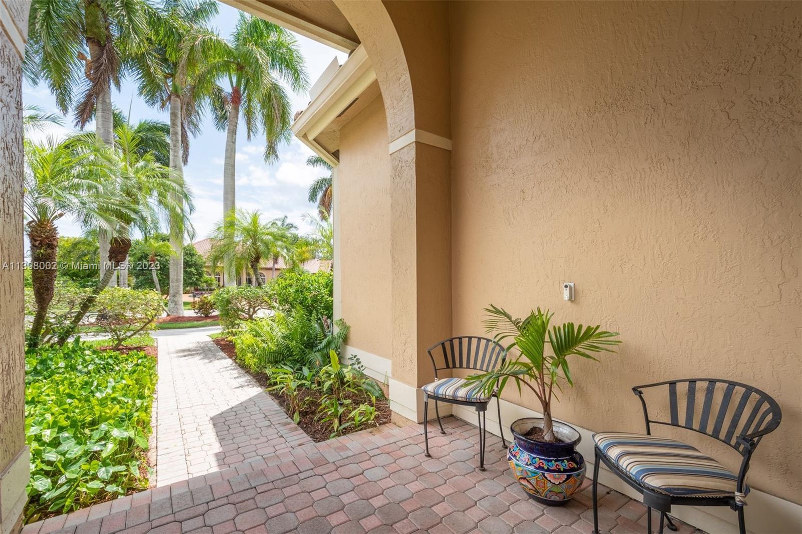 3155 Inverness Weston, FL 33332 - Photo 19 of 58 a view of a chair and table in backyard