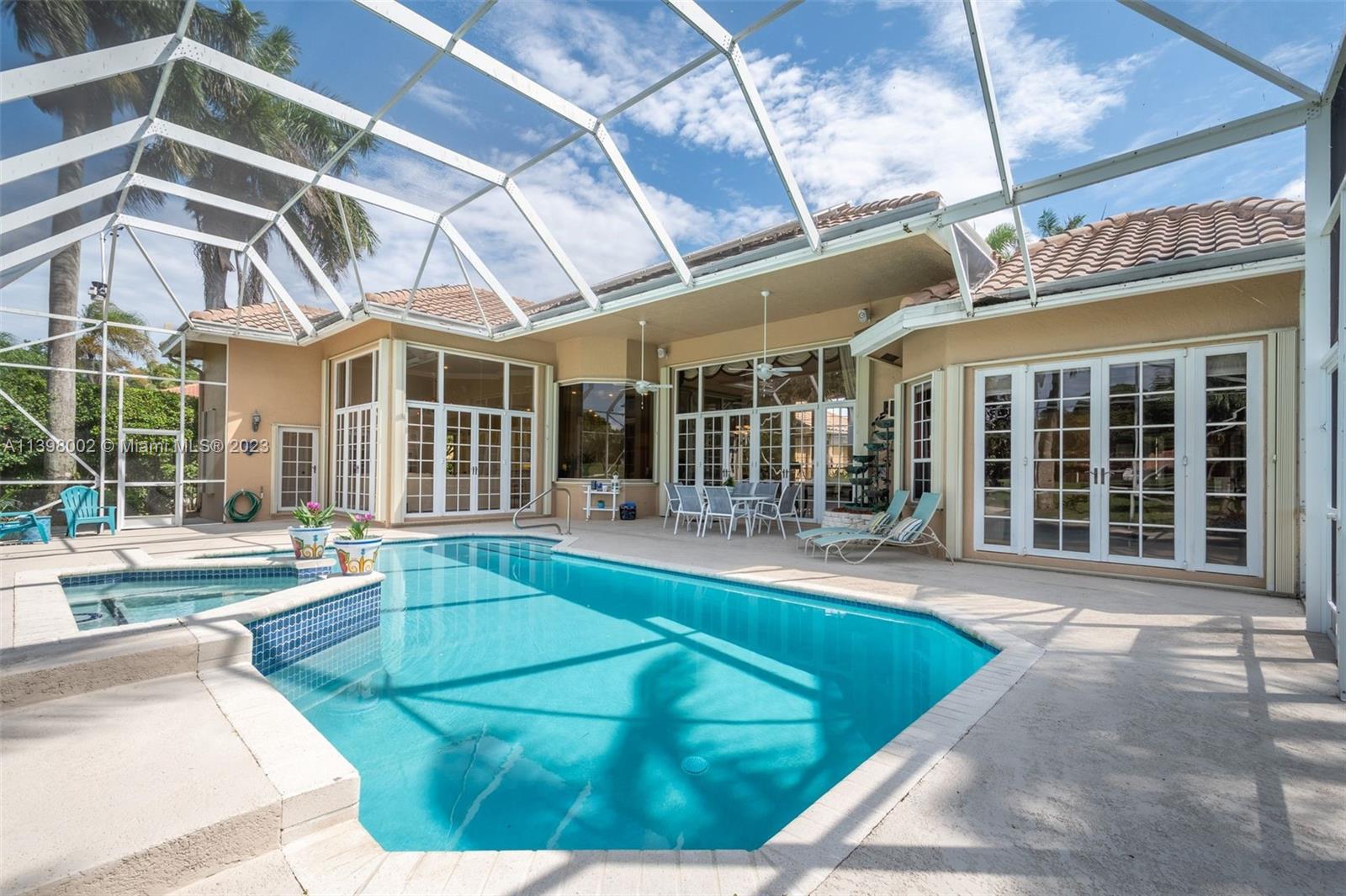 3155 Inverness Weston, FL 33332 - Photo 24 of 58 a view of a house with a swimming pool