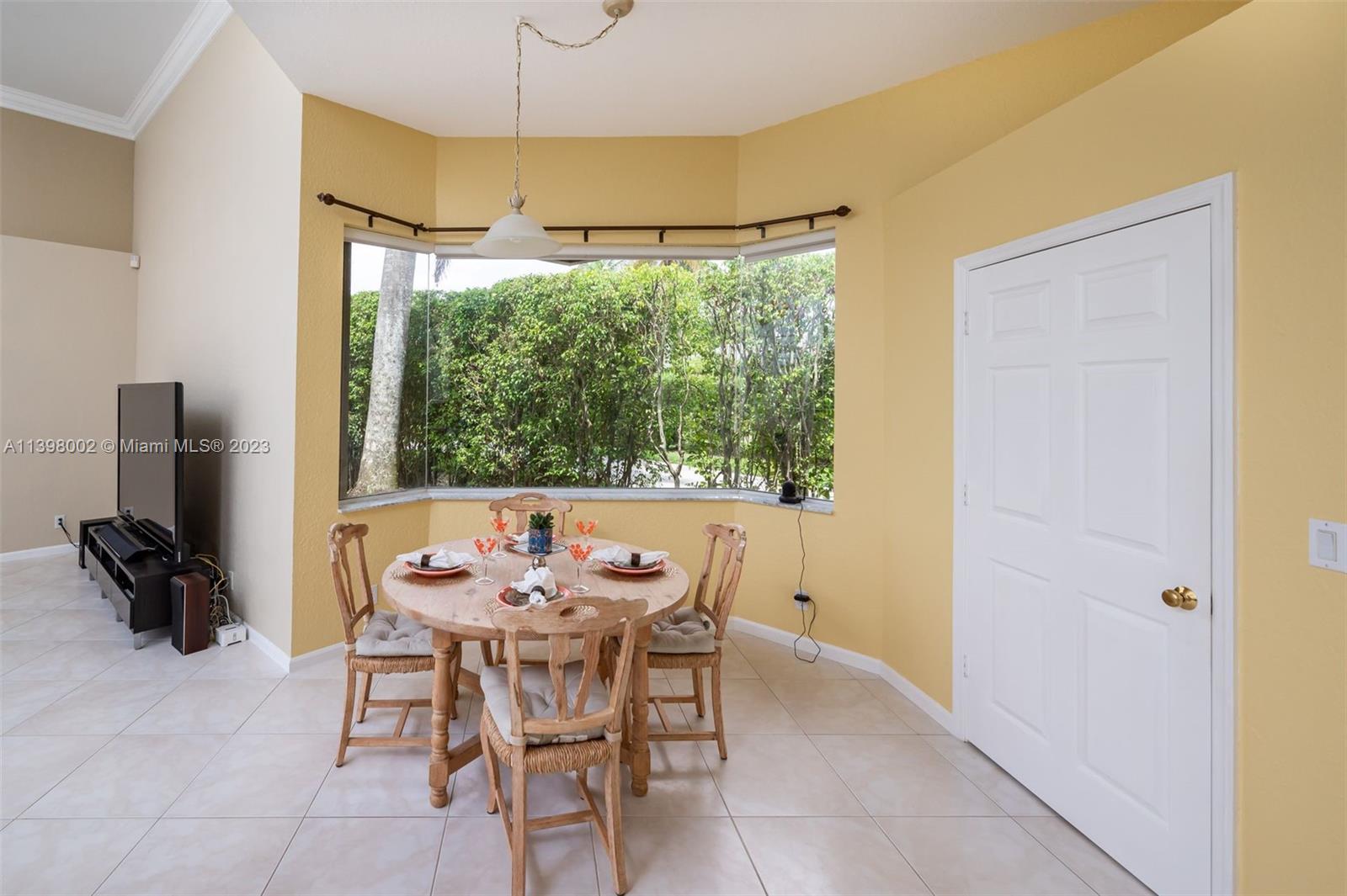 3155 Inverness Weston, FL 33332 - Photo 42 of 58 a view of a dining room with furniture window and outside view