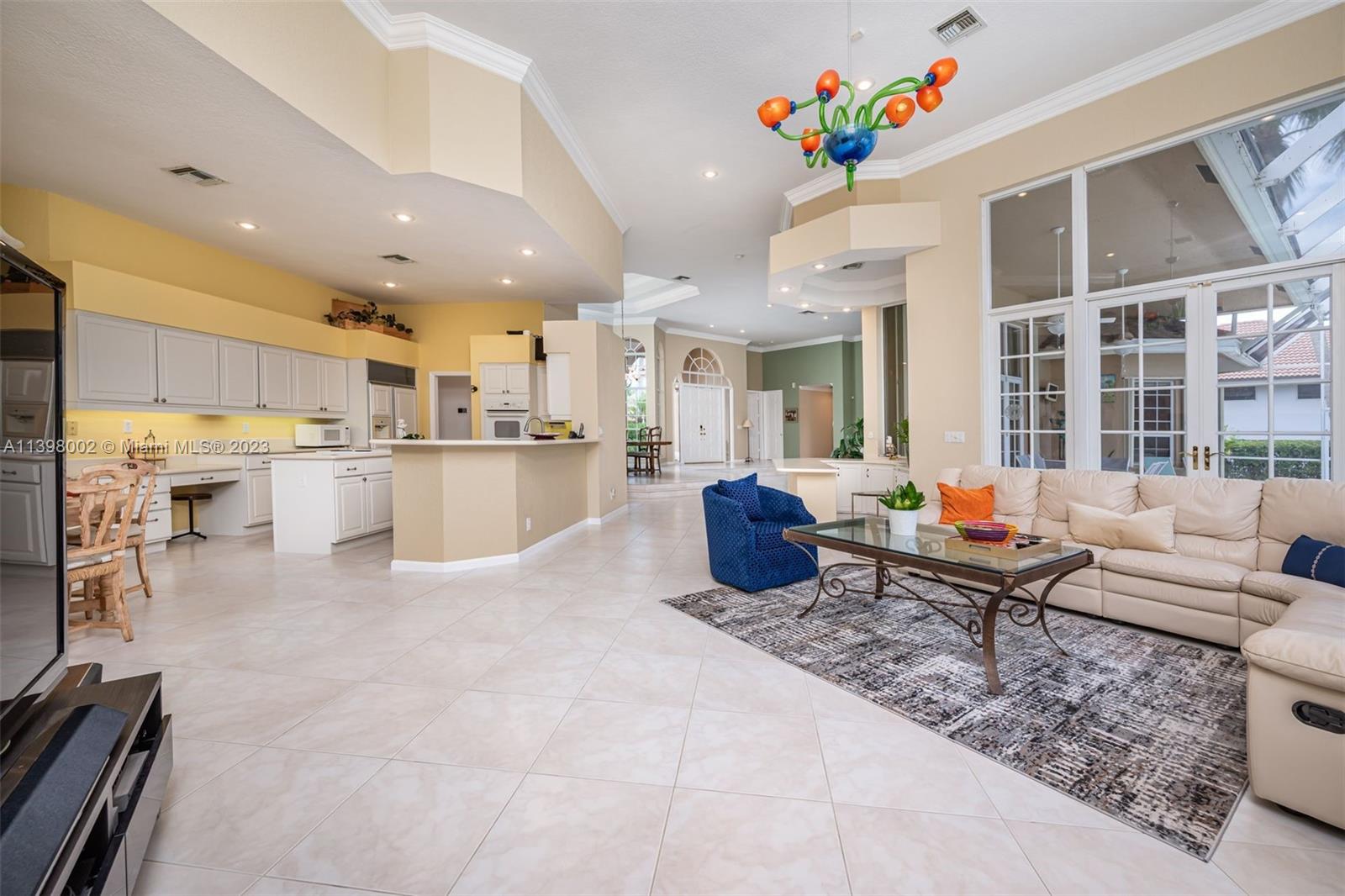 3155 Inverness Weston, FL 33332 - Photo 45 of 58 a living room with furniture and kitchen view