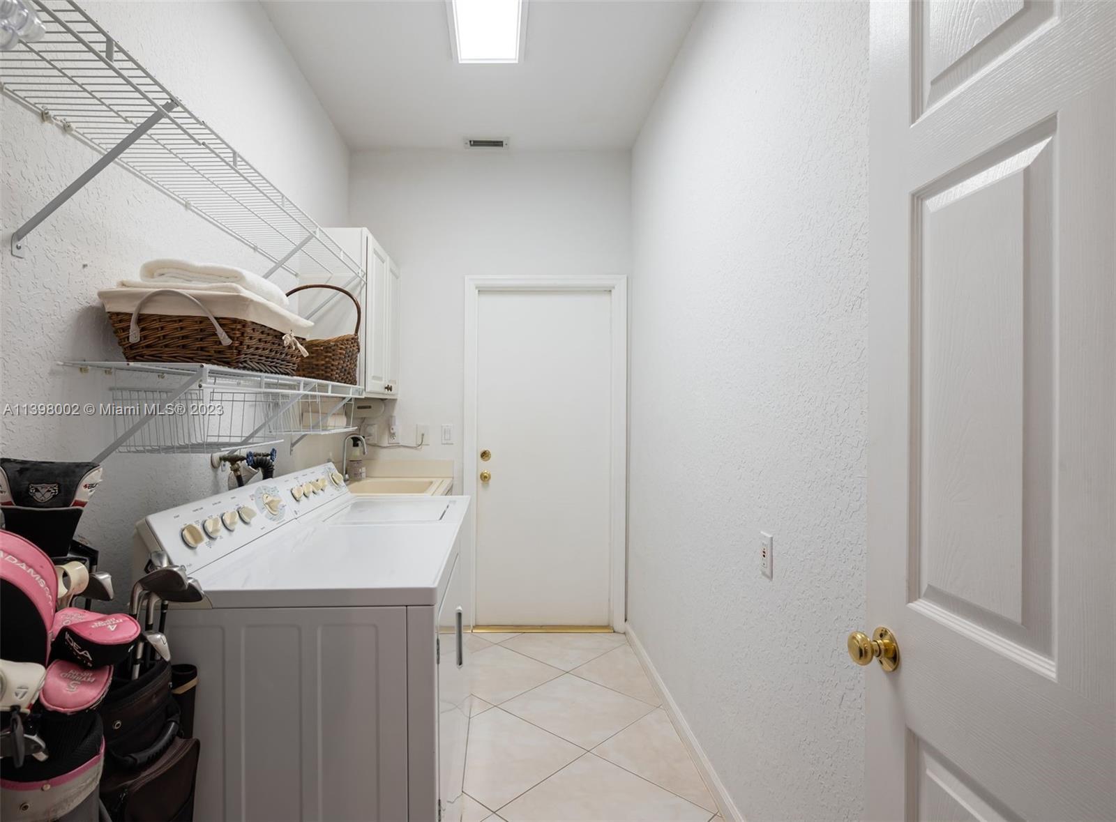 3155 Inverness Weston, FL 33332 - Photo 55 of 58 a utility room with dryer and washer