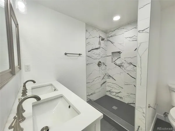 a bathroom with a sink and shower
