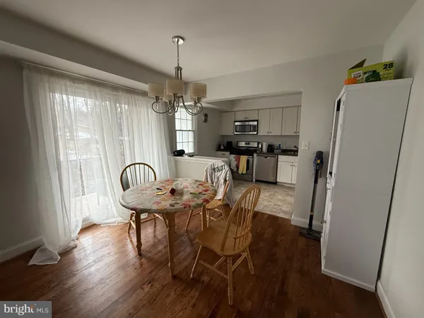 a view of a dining room with furniture and window