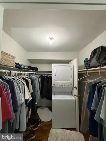 a bedroom with a bed a table and chair