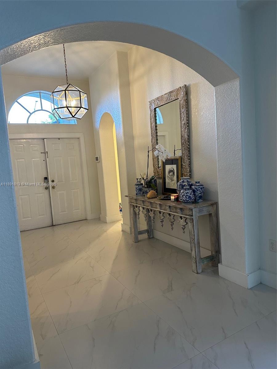 3744 Southwest 156th Court Miami, FL 33185 - Photo 2 of 10 a room with mirror and furniture