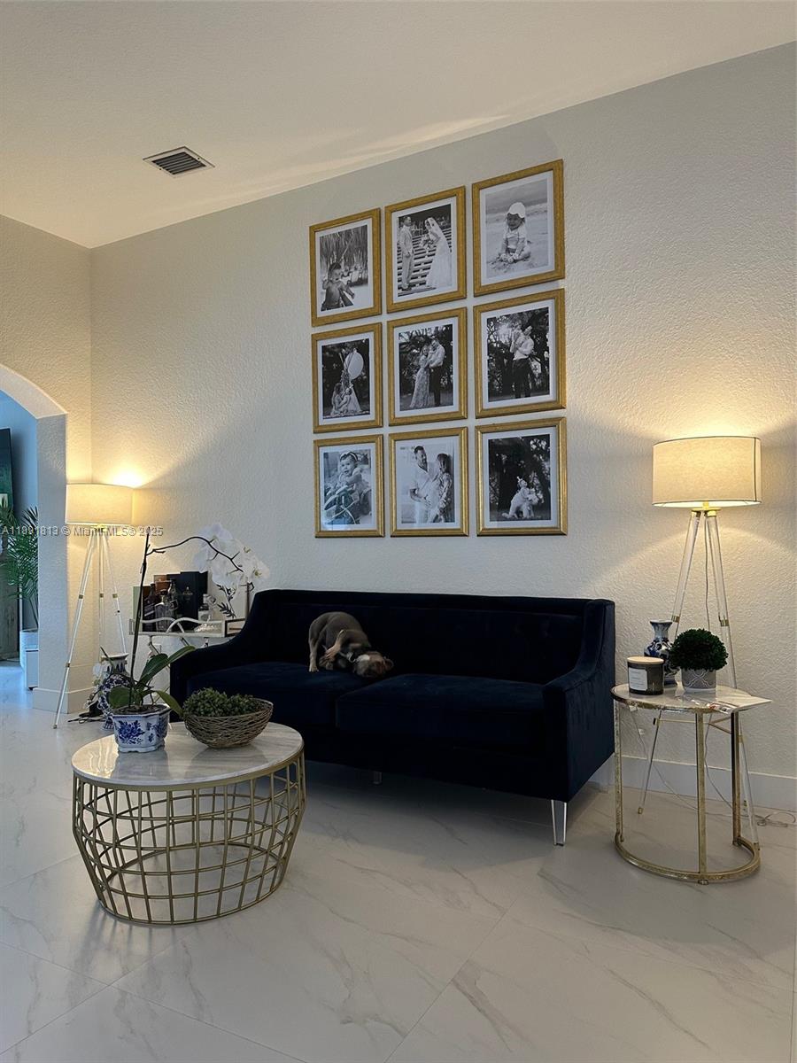 3744 Southwest 156th Court Miami, FL 33185 - Photo 4 of 10 a living room with furniture and a window