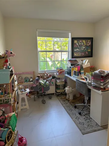 a room with furniture and a window